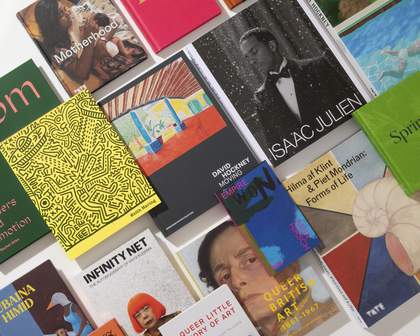 Art books arranged on a white background