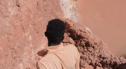 A man standing at a quarry