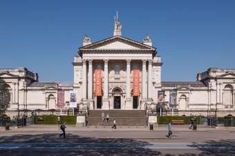 Front of Tate Britain, large building with steps up to the entrance and columns.