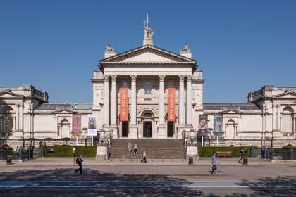 Front of Tate Britain, large building with steps up to the entrance and columns.