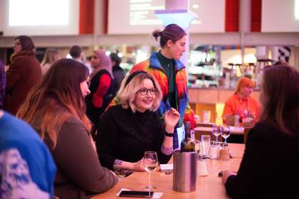 Visitors sitting and drinking in the Tate Liverpool café during a late night event