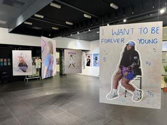 A photograph of the display of posters and artwork in the Metquarter