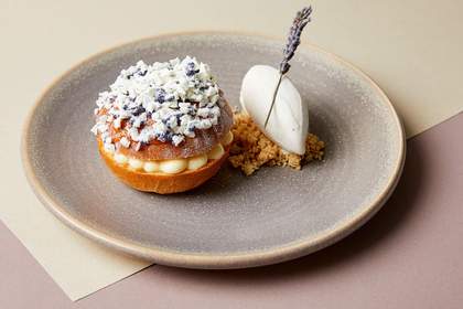 Dish of food showing the famous French dessert 'tarte Tropezienne'