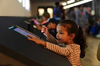 Young girl drawing on a tablet