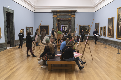 People talking and spending time in the galleries after hours