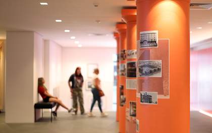 A photograph of people in an art gallery.