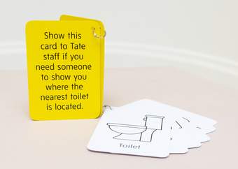 Yellow and white communication cards attached by a key ring