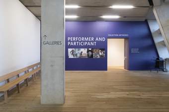 A blue entrance to a display called Performer and Participant