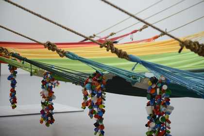 Children playing in colourful hammocks