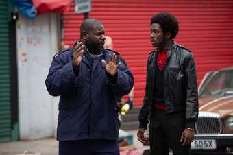 Steve McQueen with actor Sheyi Cole on the set of Small Axe, Alex Wheatle 2020