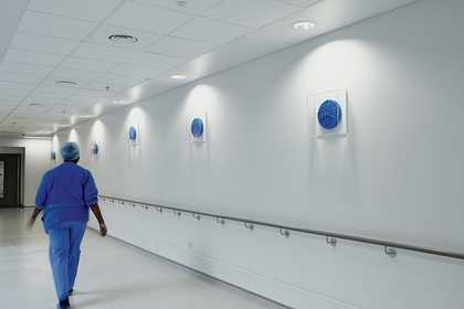 A member of the medical team at the Royal London Hospital oberves Roger Hiorns's Untitled 2012