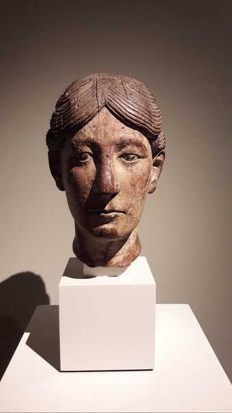 A carved head, possibly from a reliquary bust, French, second half of 12th century