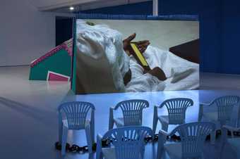 installation view of a film in gallery space