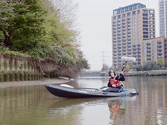 Anne Hardy in a kayak recording riverscape sounds