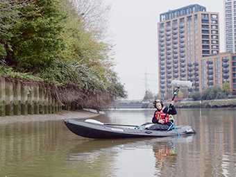 Anne Hardy in a kayak recording riverscape sounds