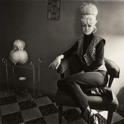 Diane Arbus, Lady Bartender at Home with a Souvenir Dog, New Orleans L.A. 1964 1964, printed after 1971 The Estate of Diane Arbus LLC