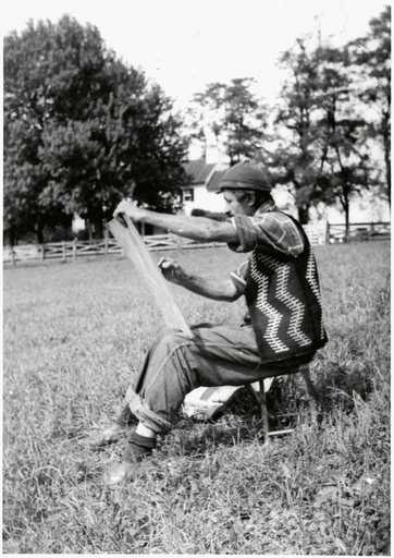 Arshile Gorky drawing in a field at Crooked Run Farm 1944