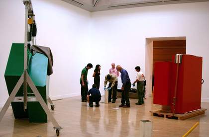 Art handlers during installation of Philip King's Call