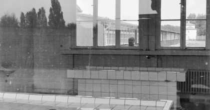 Black and white photograph of building with tiles