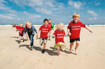 Children running on Porthmeor Beach, St Ives