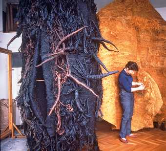 Magdalena Abakanowicz working on one of her Abakan sculptures