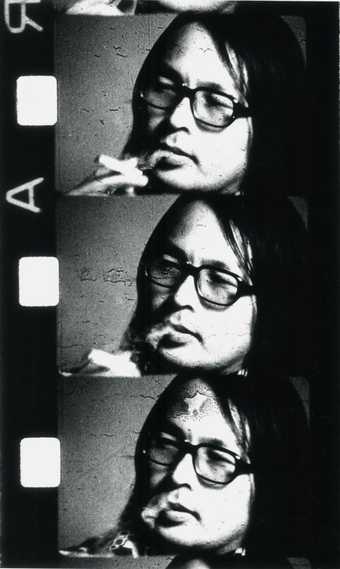 Photographic portrait of Toshio Matsumoto multiplied three times on a roll of film