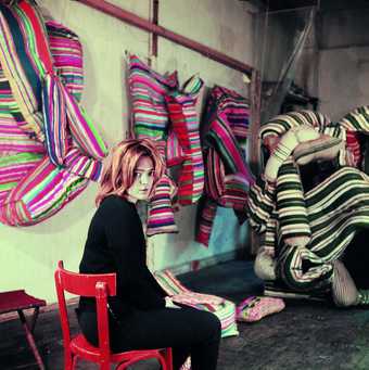 Marta Minujín in Paris with her work Mattress before destruction