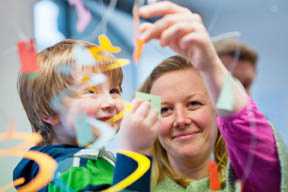 Image displaying a mother and son enjoying a Tate Liverpool family activity
