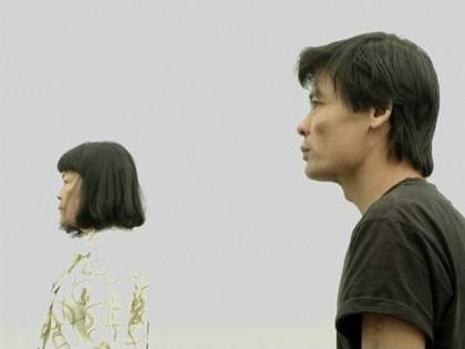A man and a woman in profile on a white background