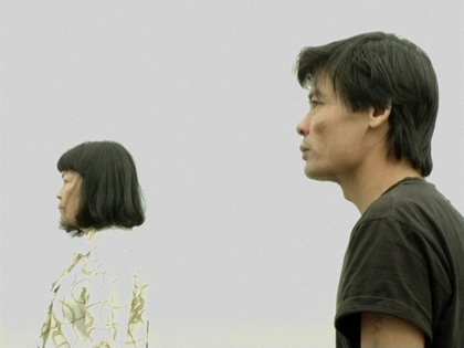 A man and a woman in profile on a white background