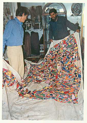 Boetti inspecting the production of a Tutto (Everything) embroidery in Peshawar, 1989