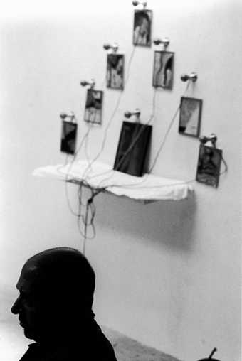 Christian Boltanski, silhouette with work in backdrop