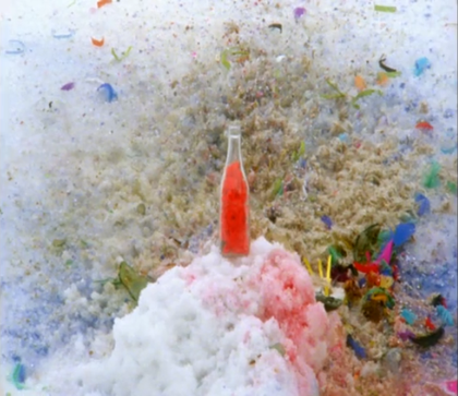 Red bottle on a rock