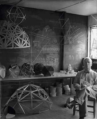 Buckminster Fuller in his classroom at Black Mountain College, photographed by Hazel Larson Archer, summer 1948