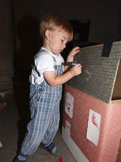 Kid adding details to his house