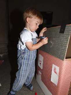 Kid adding details to his house