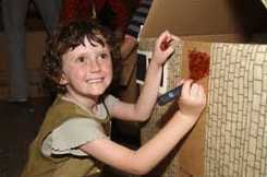 Kid making her house