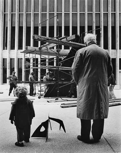 Alexander Calder installing Le Guichet 1963 with grandson Alexander S. C. Rower, Lincoln Center, New York, photographed by Bob Serating, 1965