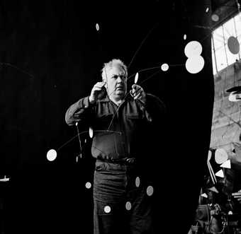 Alexander Calder with Snow Flurry I 1948, photographed by Gordon Parks, 1952