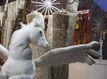 Bonnie Camplin film still from Terrazzo 2008 showing a large plush toy white horse with wings