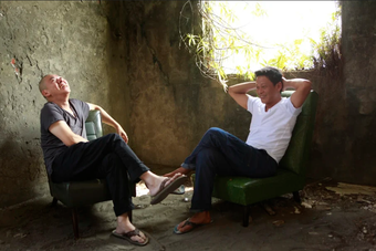 Tsai Ming-liang and Lee Kang-sheng laughing in their mountainside home