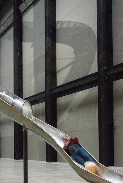A man in motion, emerging from one of the slides in Carsten Höller Test Site 2006