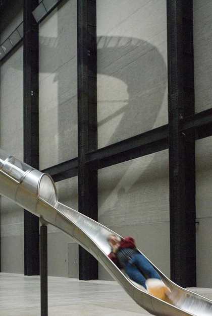 A man in motion, emerging from one of the slides in Carsten Höller Test Site 2006