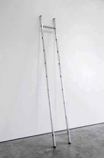 Ceal Floyer Ladder minus 2to 8  2010 photograph of an aluminium ladder leaning against a white gallery wall with all the rungs missing apart from the top rung 