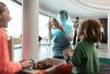 Children having fun with costumes and mirrors