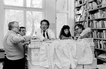 Lost Art: Christo and Jeanne-Claude work on a model of the Reichstag with assistants 1984