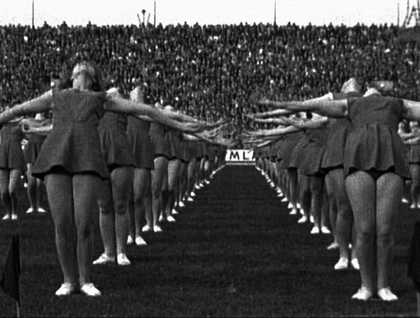 Marta Popivoda, Yugoslavia, How Ideology Moved Our Collective Body 2013 Film still showia black and white photo of cheerleaders 