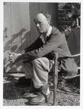 Photograph of Clive Bell on the terrace at Charleston farmhouse © Tate Archive