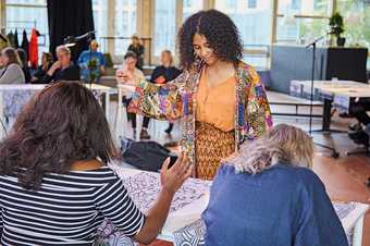Visitors to De Appel, Amsterdam take part in a Stitch In sewing workshop led by artist Patricia Kaersenhout, 2019