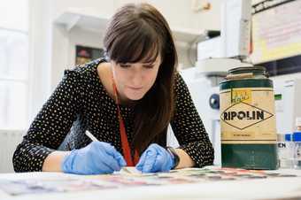 Someone sampling paint in Tate Gallery's conservation team